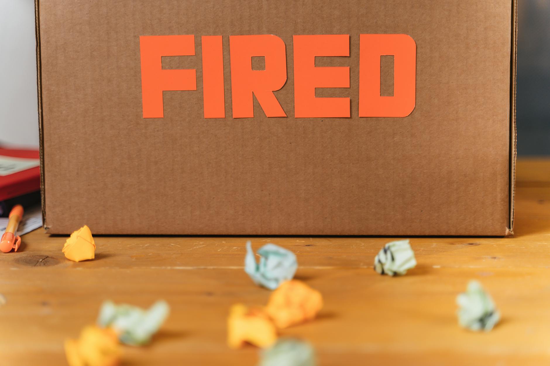 Microsoft Layoffs | Microsoft में हाल ही में हुई छंटनी (layoffs) के बारे में यहाँ जानकारी दी गई है text fired on cardboard